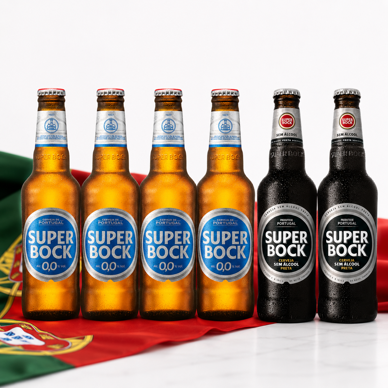 Six bottles of Super Bock 0.0% alcohol-free beer arranged in two groups of three, with four amber glass bottles on the left and two dark brown bottles on the right, set against a white background with a red and green flag at the bottom.