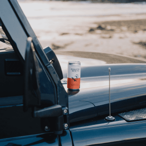 Pentire Coastal Spritz non alcoholic aperitif 200ml can placed on a car with coastal background